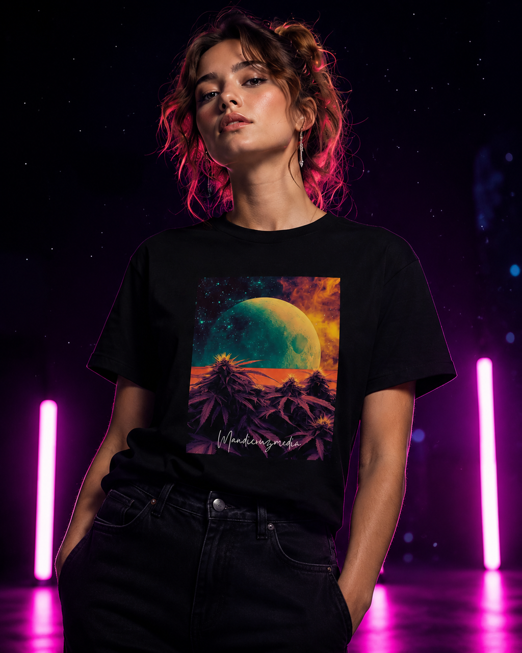 Woman modeling the black Outer Space organic tee with green moon artwork between hot-pink neon lights.