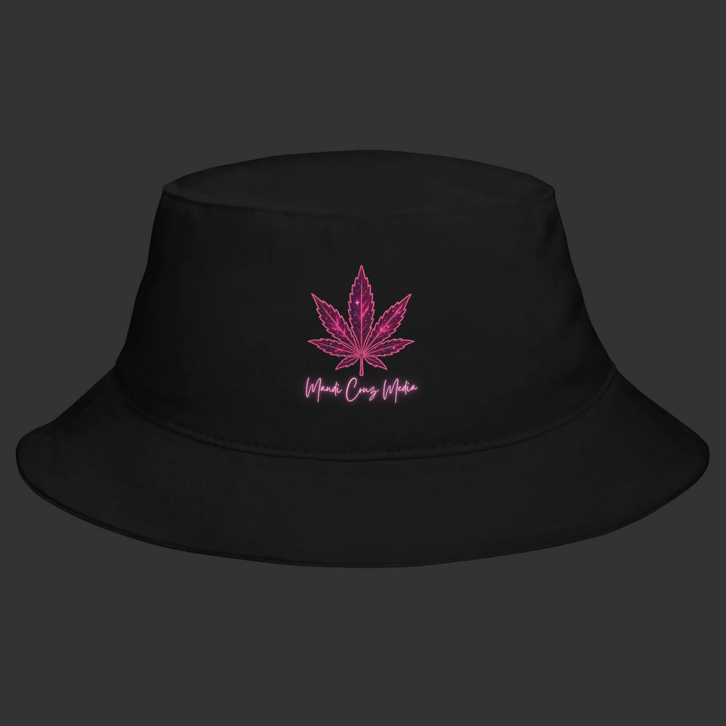 Front product view of the black cotton bucket hat embroidered with the signature pink Mandi Cruz Media leaf design.