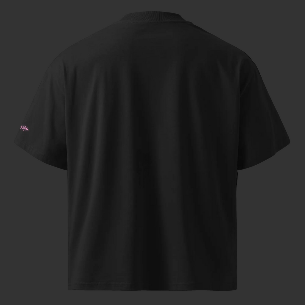 Back view of the black oversized organic tee with a plain finish and small pink Mandi Cruz Media sleeve signature.