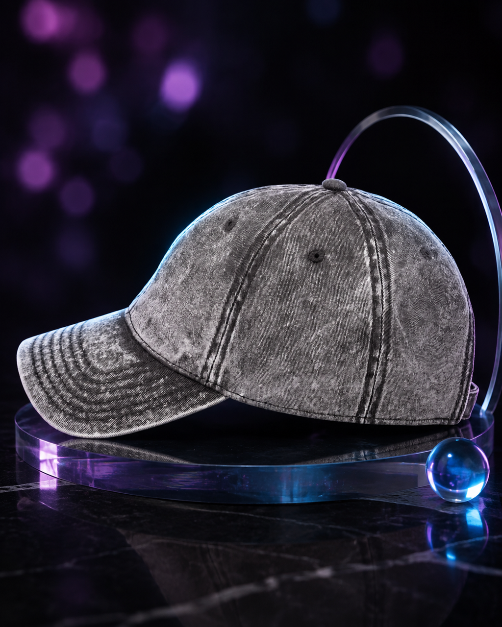 Blank side profile of the charcoal grey cotton twill cap displayed on acrylic with violet and cyan lighting.