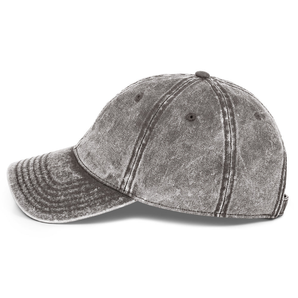 Left-side view of the charcoal grey acid-wash cotton twill cap with a curved stitched brim.