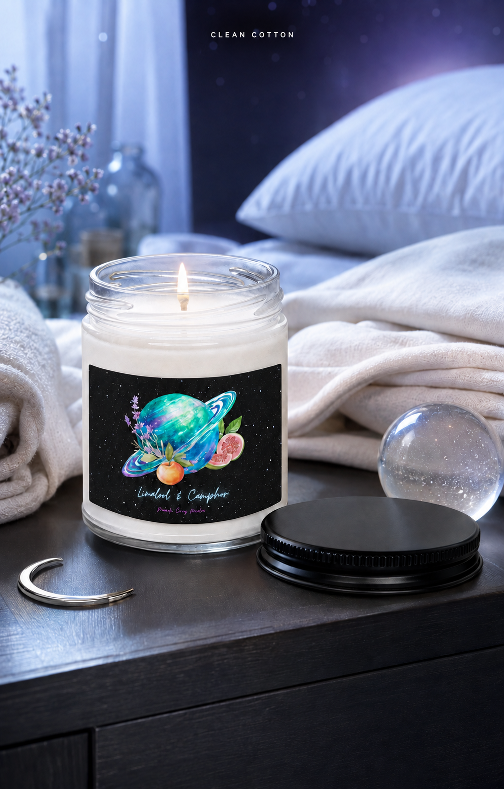 Clean Cotton soy candle beside freshly folded white linens in a serene celestial bedroom setting.
