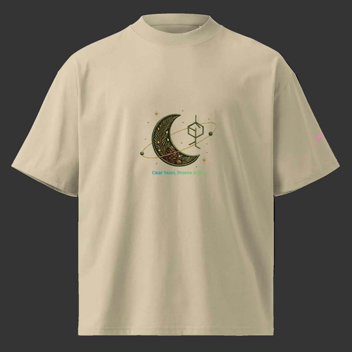 Front view of the stone oversized high-neck tee with a botanical crescent moon, pinene molecule, and Clear Skies, Pinene Vibes design.