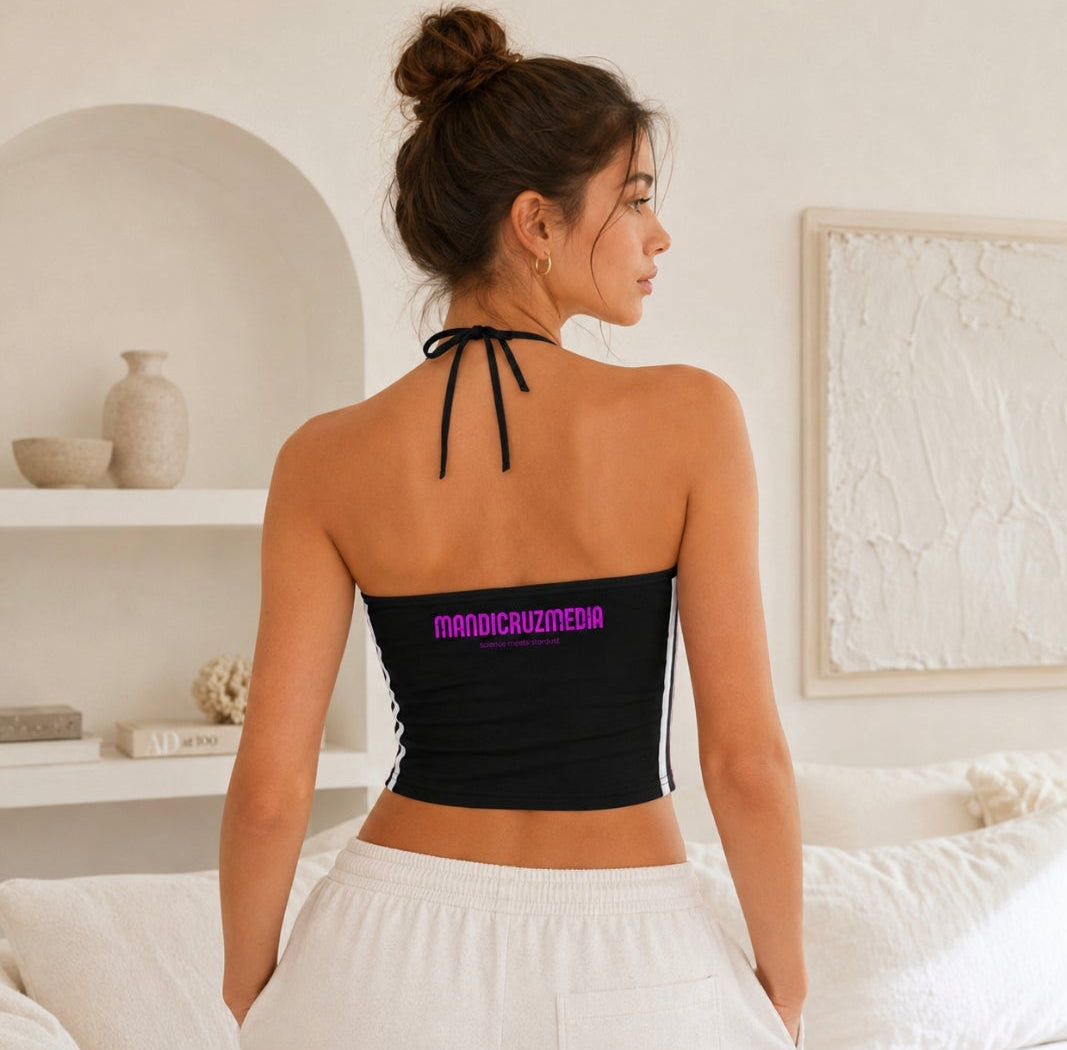 Back view of woman wearing the black tie-neck Cosmic Heart halter crop top with pink Mandi Cruz Media branding.