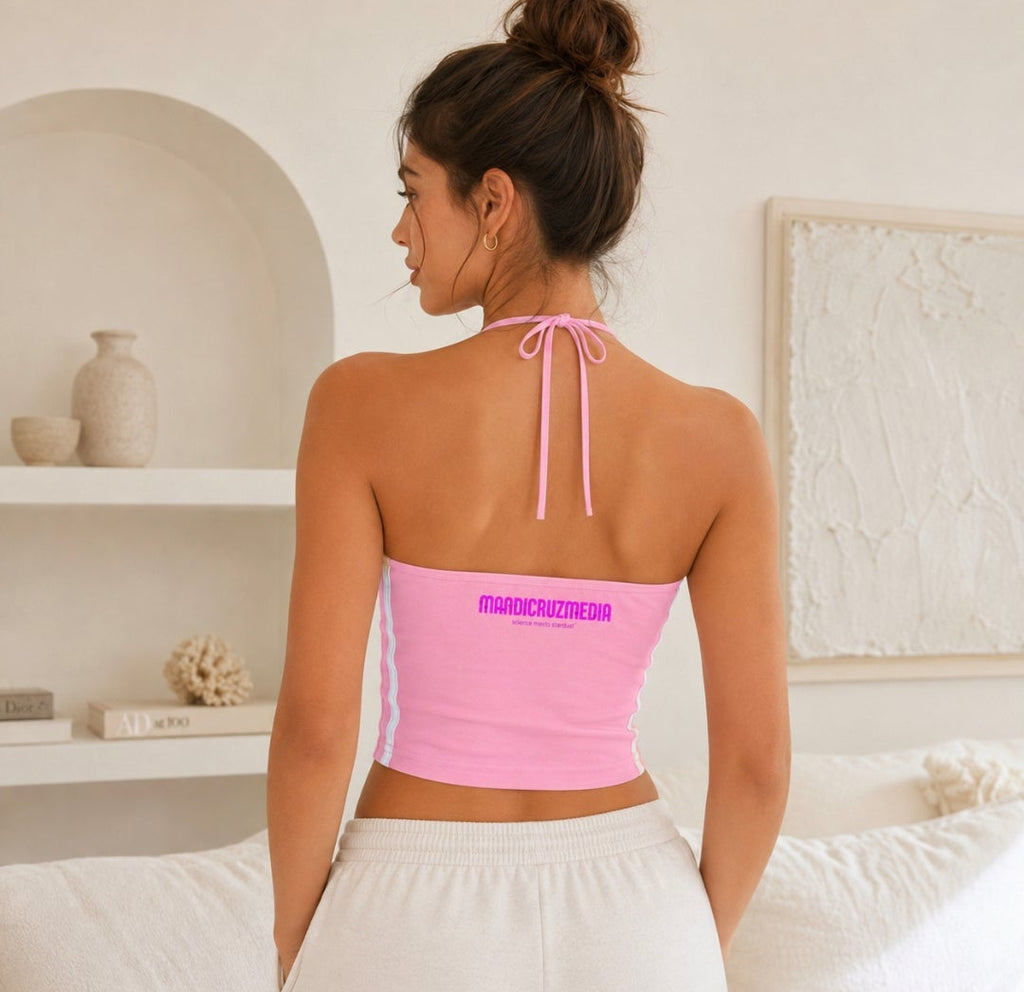 Back view of woman wearing the pink Cosmic Heart halter crop top with halter ties, white side stripes, and Mandi Cruz Media branding.