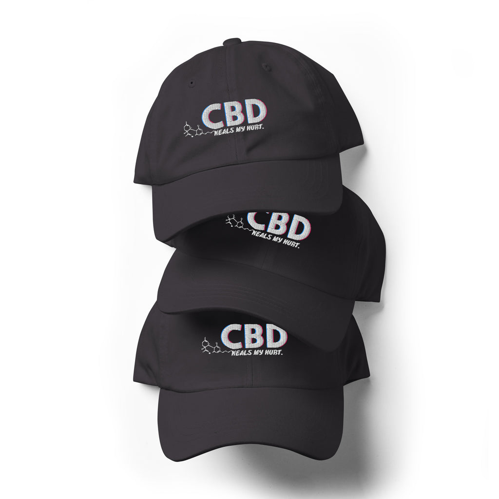 Three dark grey CBD Heals My Hurt embroidered dad hats arranged in a vertical product stack.