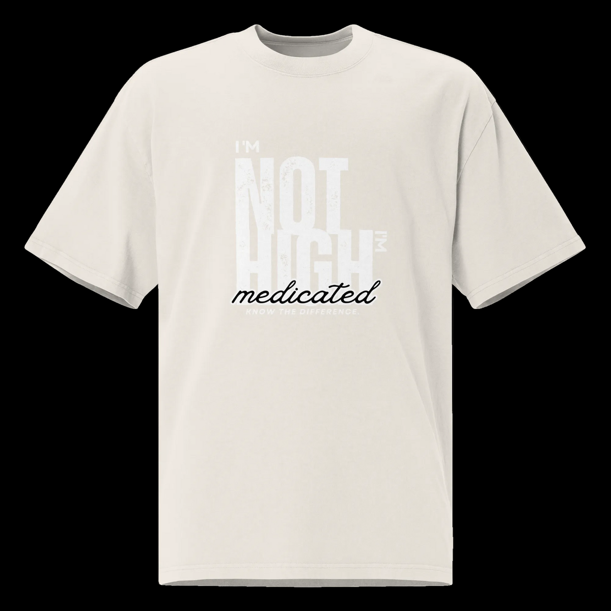 Front view of the faded bone oversized tee with the contrasting “I’m Not High, I’m Medicated” statement graphic.