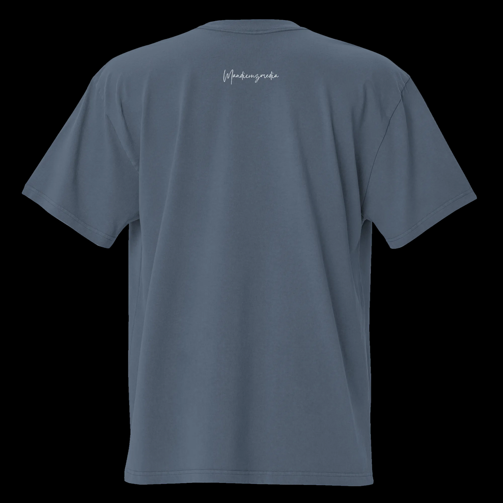Back view of the faded indigo oversized tee with a small white Mandi Cruz Media script logo below the collar.