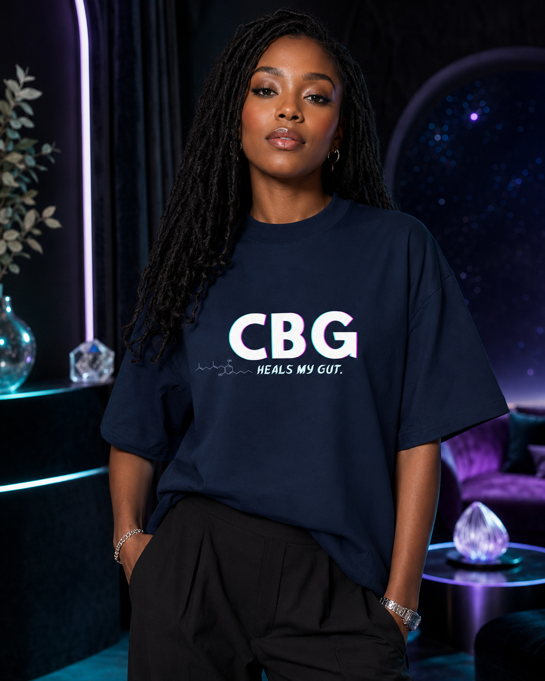 Woman wearing the French Navy CBG Heals My Gut oversized organic tee in a premium violet-and-cyan cosmic lounge.