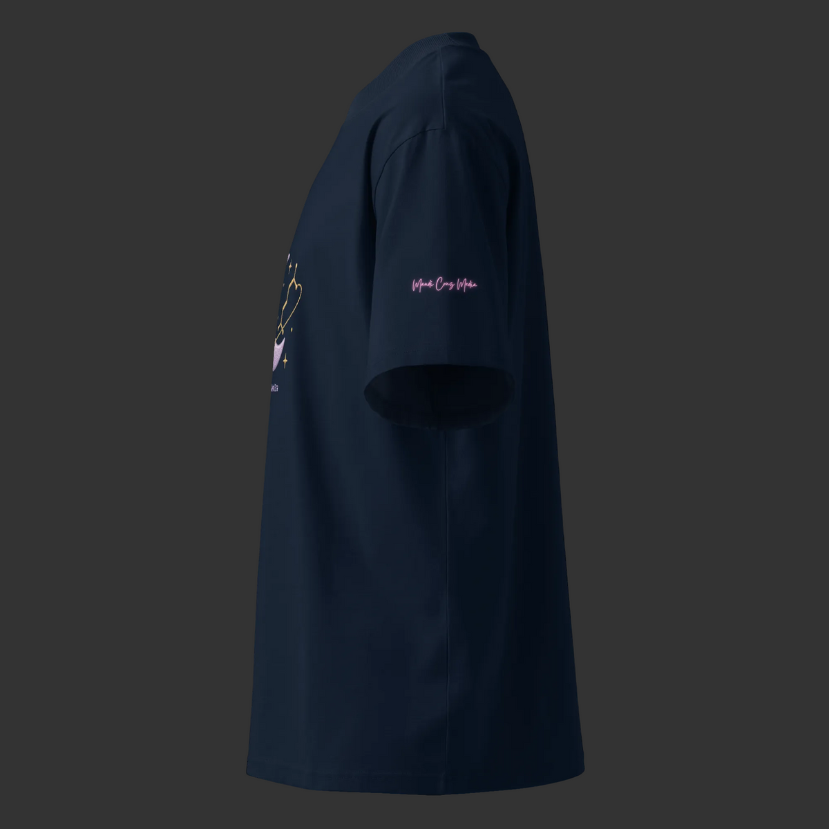 Left-side view of the French-navy oversized tee showing its relaxed fit and pink Mandi Cruz Media sleeve signature.