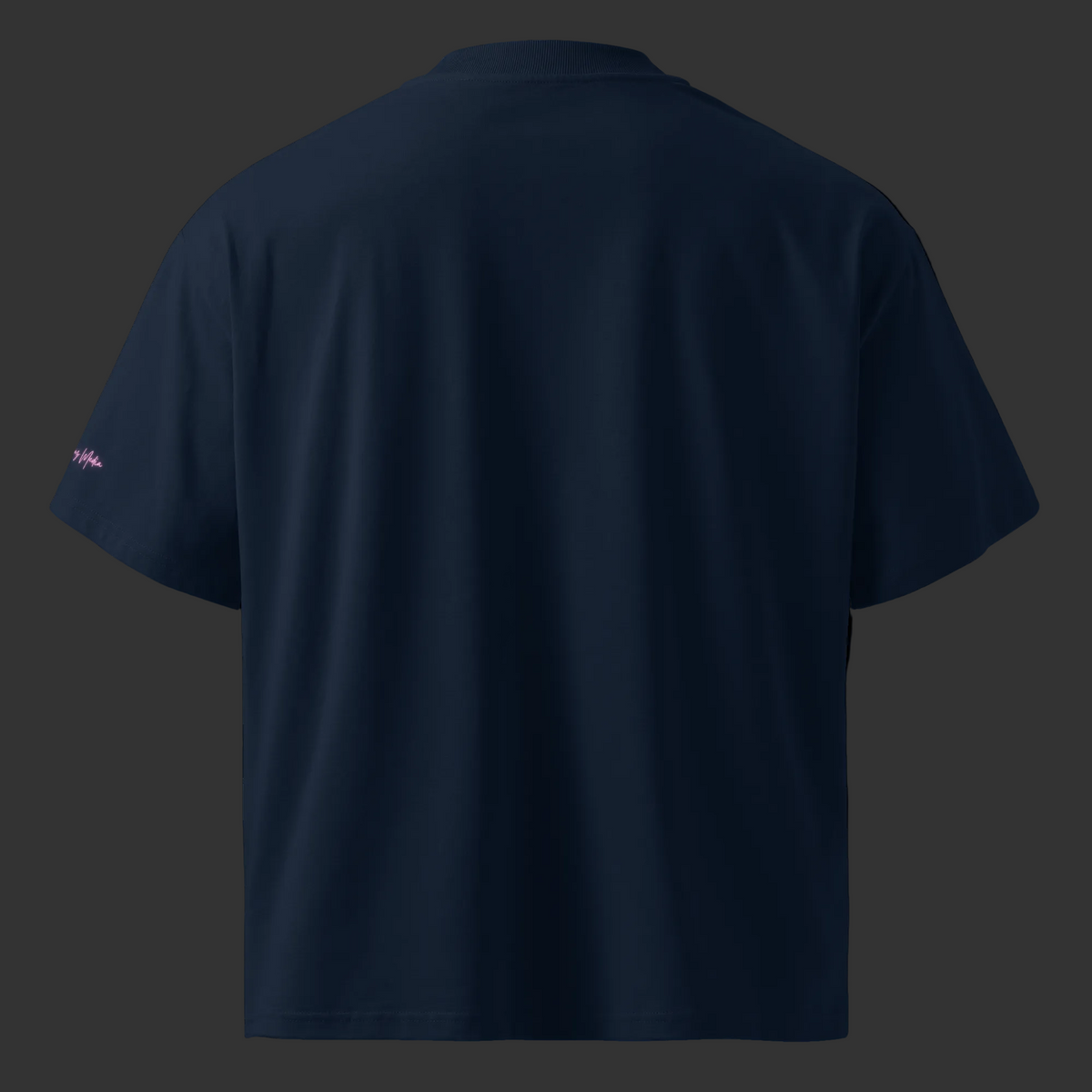 Back view of the French-navy oversized organic tee with a plain back and pink sleeve signature.