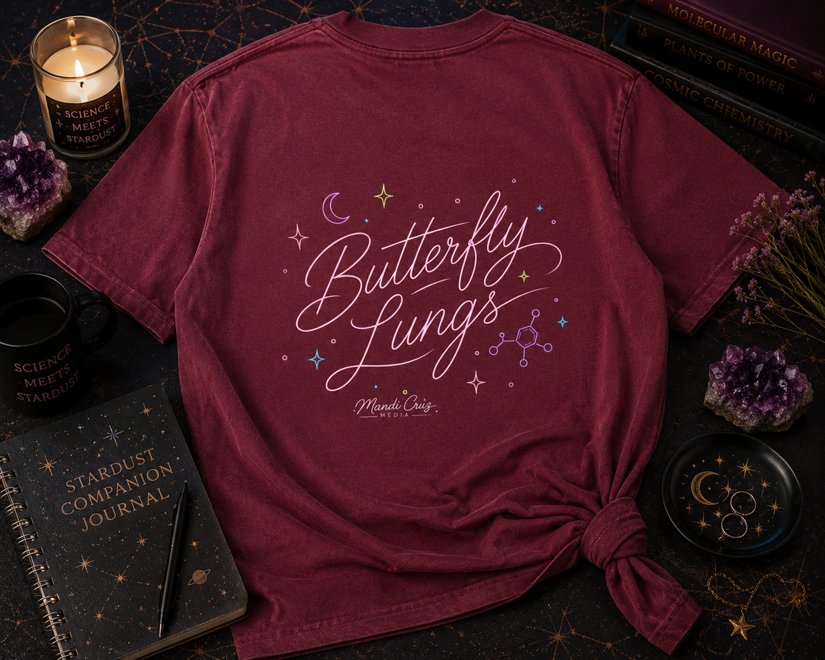 Lifestyle detail view of the Mandi Cruz Media Butterfly Lungs™ T-shirt showing its vintage-washed cotton finish, frayed details, and oversized fit.