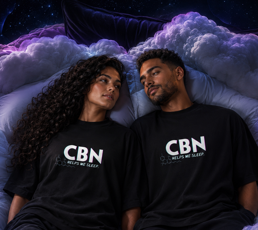 Woman and man reclining together on cloud bedding in matching black CBN Helps Me Sleep oversized tees.