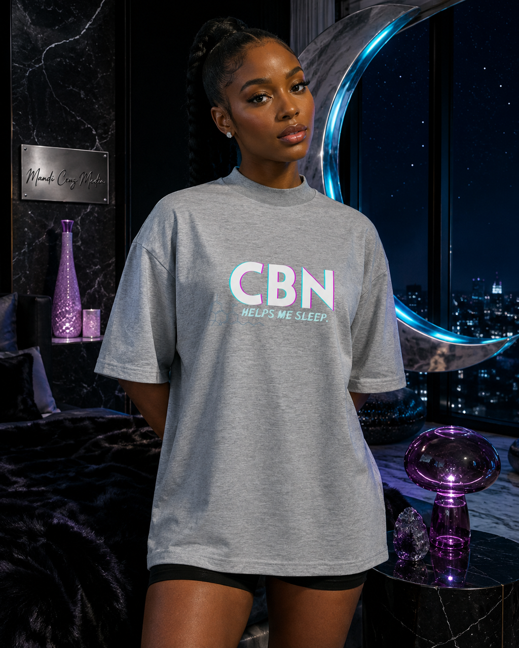 Woman wearing the Heather Grey CBN Helps Me Sleep oversized tee in a moonlit cosmic bedroom.