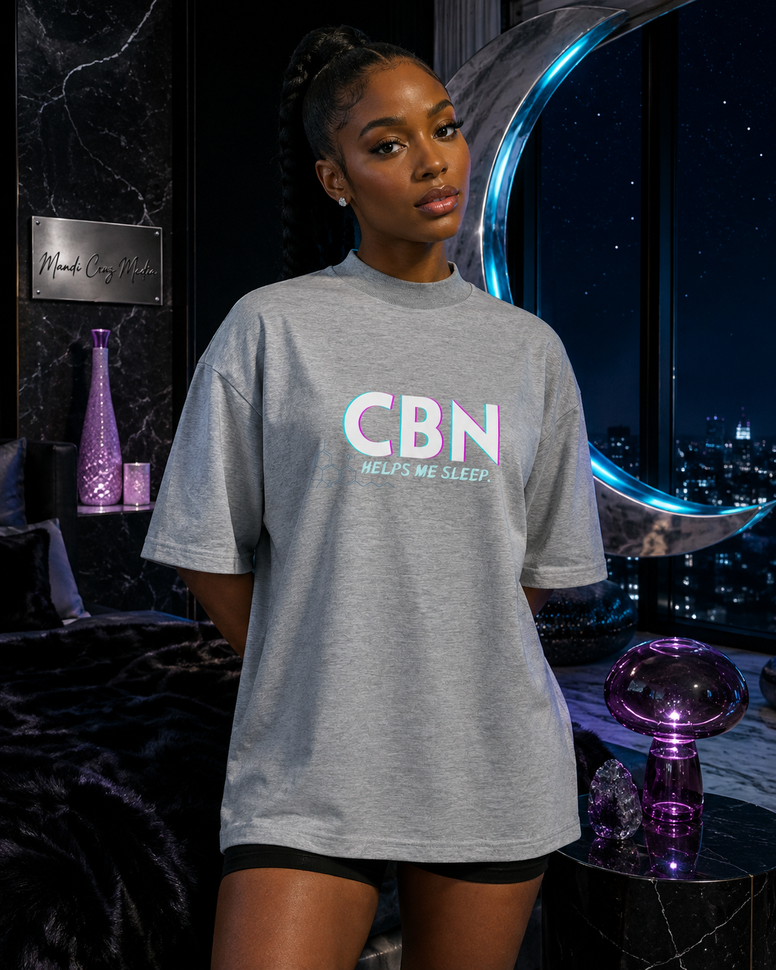 Woman wearing the Heather Grey CBN Helps Me Sleep oversized tee in a moonlit cosmic bedroom.