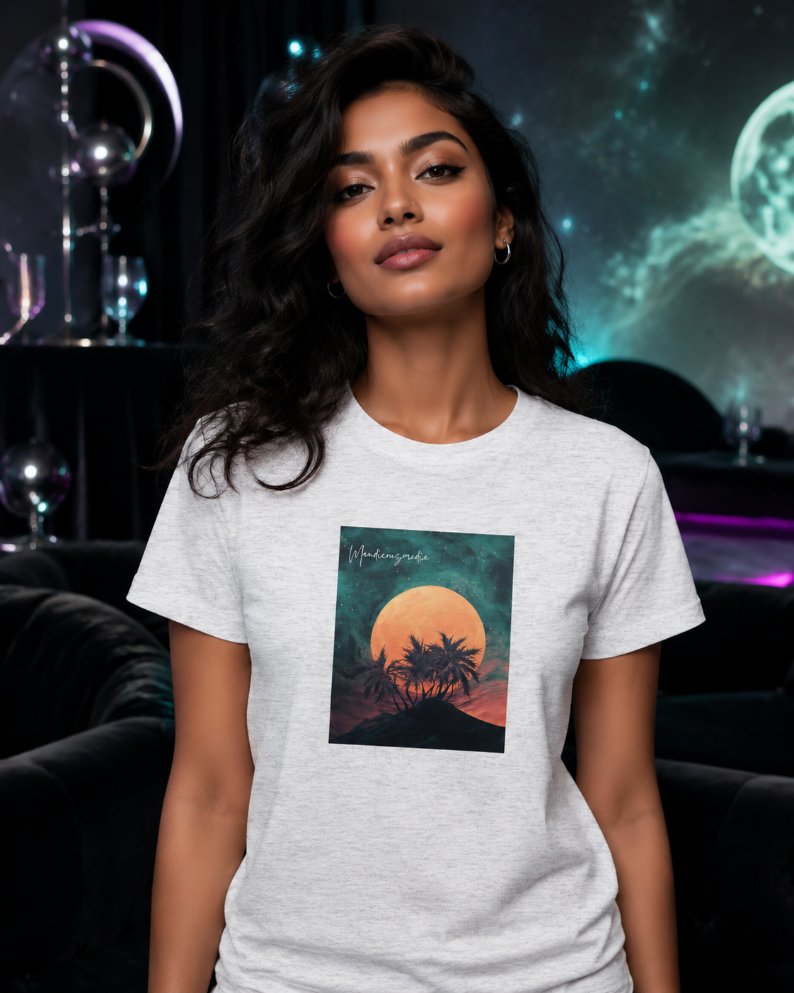 Woman wearing a heather white moon-and-palm graphic T-shirt in an elegant cosmic lounge.