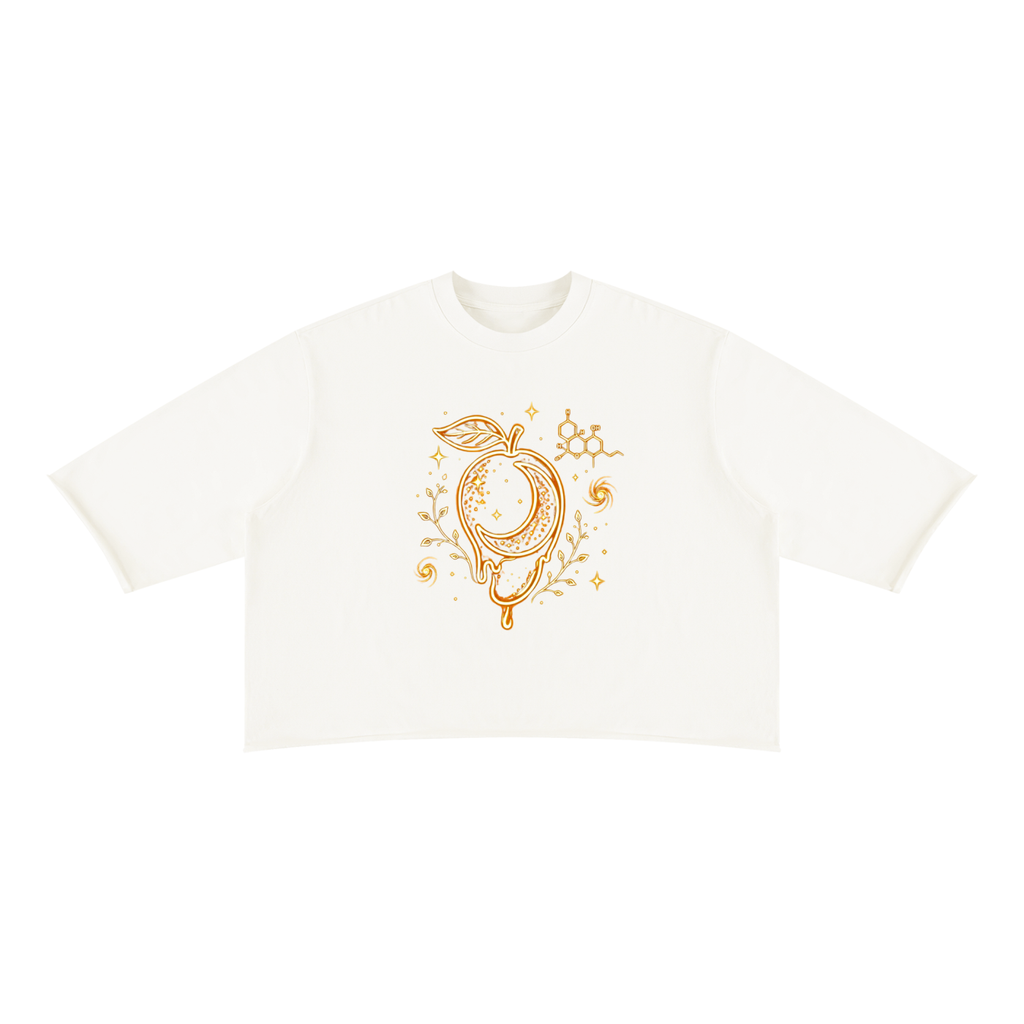 Front product view of the white raw-hem boxy tee featuring gold mango moon, celestial details, botanical sprigs and a myrcene molecule.