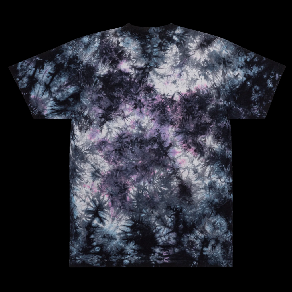 Front view of the oversized Milky Way tie-dye tee with black, smoky grey and muted violet tones plus a white Mandi Cruz Media script logo.
