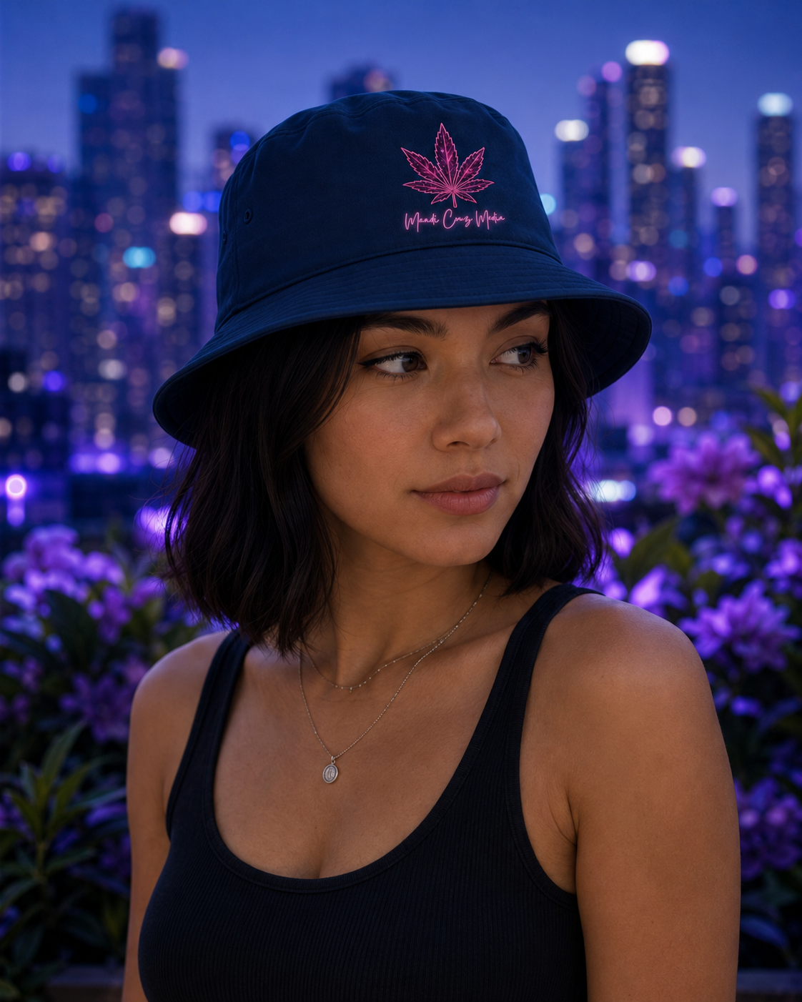 Front product view of the white cotton bucket hat embroidered with the signature pink Mandi Cruz Media leaf design.