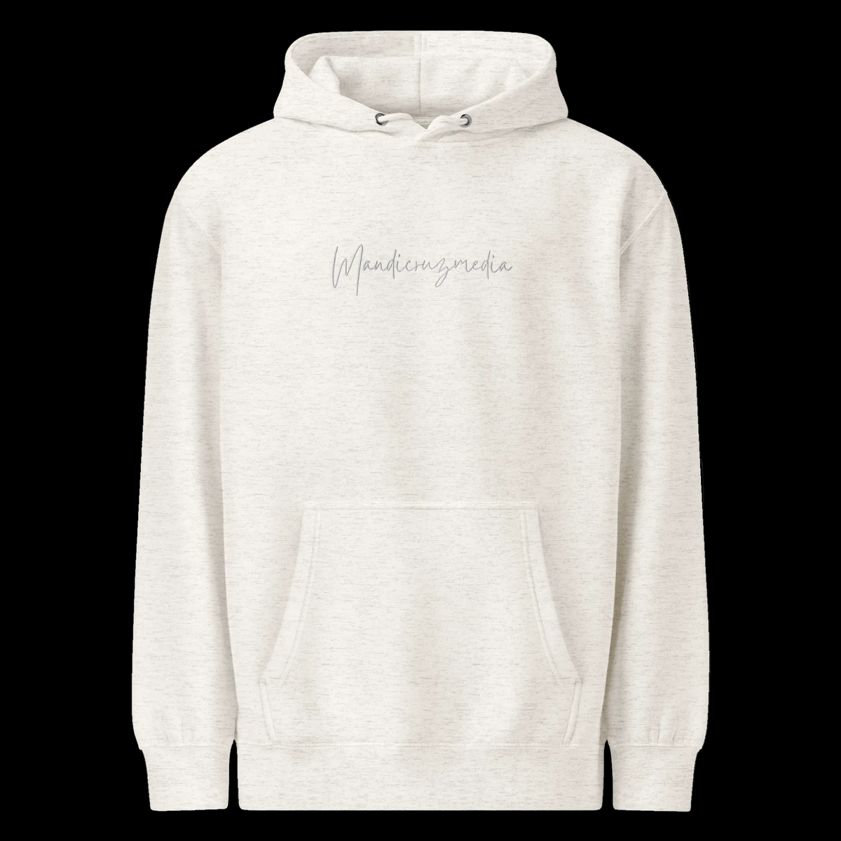 Front view of the oatmeal heather unisex Mandi Cruz Media premium midweight hoodie with subtle grey script logo and kangaroo pocket.