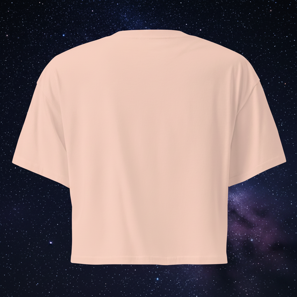 Left-side view of the pale-pink Butterfly Lungs crop top showing its relaxed sleeve, cropped hem and partial front artwork.