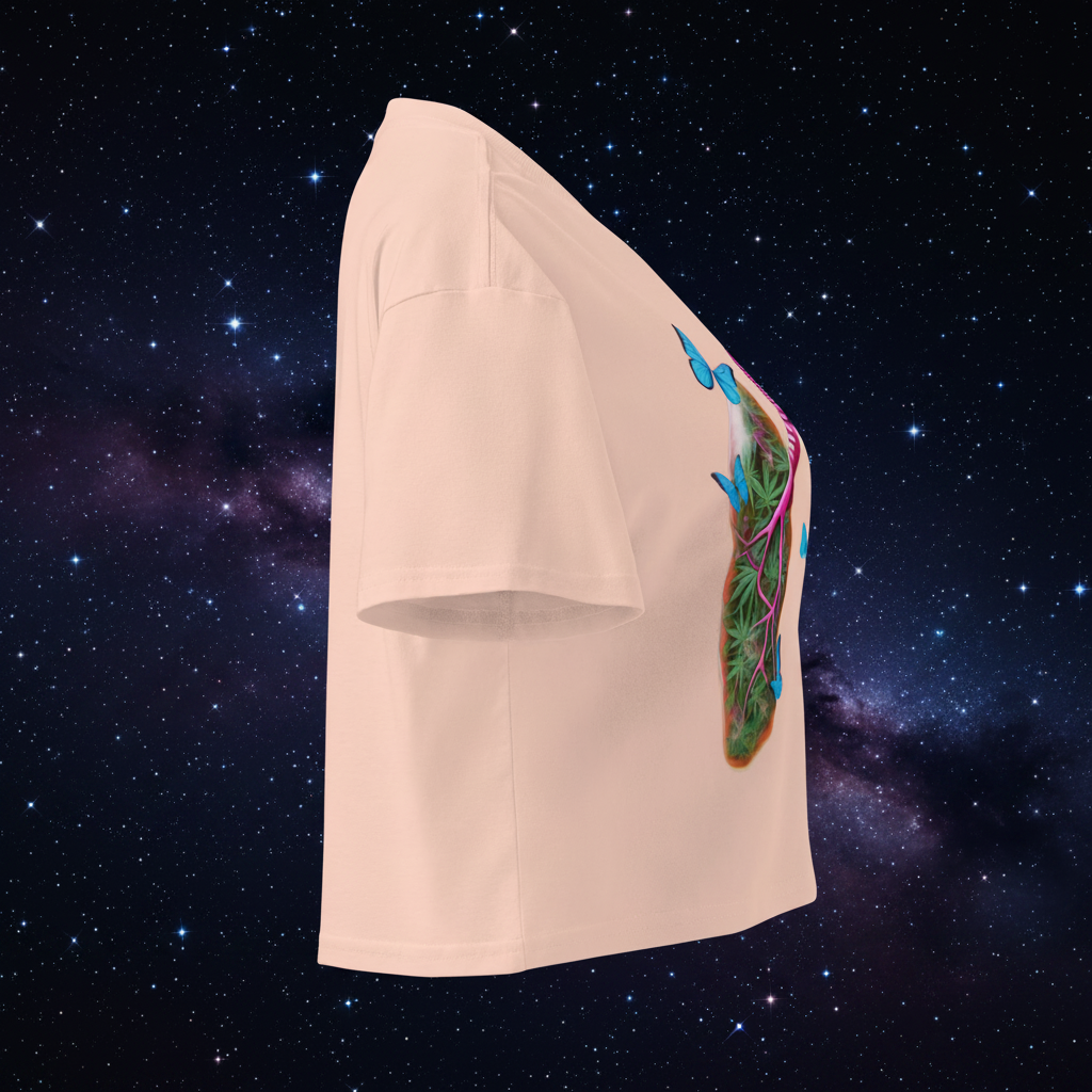 Right-side view of the pale-pink Butterfly Lungs crop top showing its relaxed fit, cropped hem and partial front artwork.