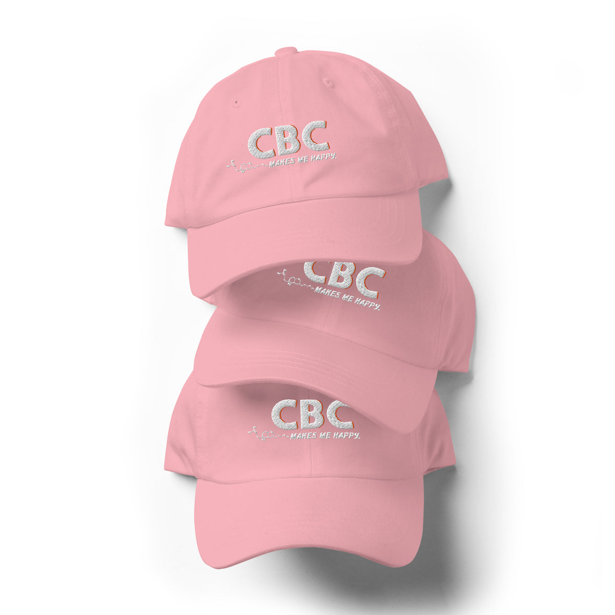 Front view of the soft pink CBC Makes Me Happy dad hat featuring embroidered lettering, a curved brim and a low-profile crown.