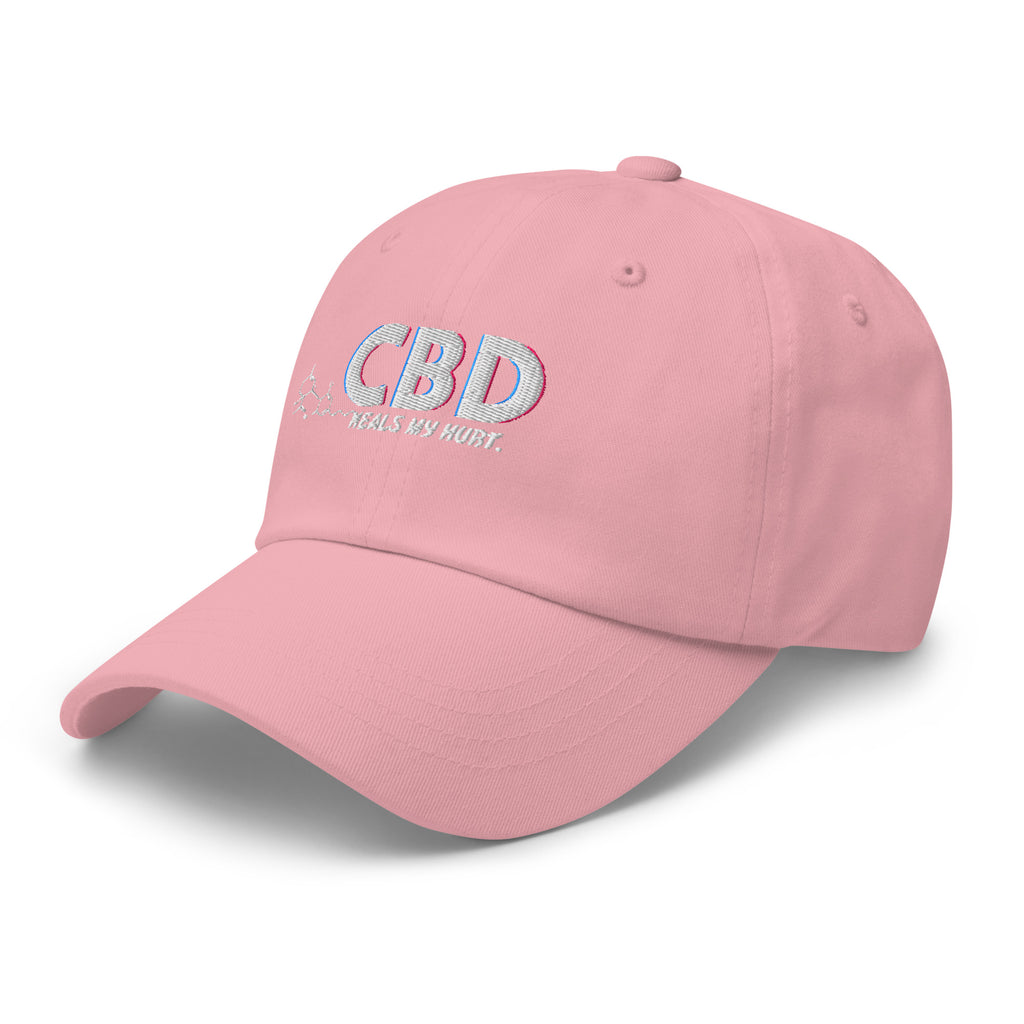 Alternate angled front view of the pink CBD Heals My Hurt dad hat with pastel lettering.