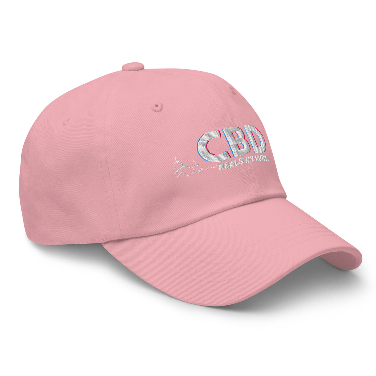 Three-quarter front view of the pink CBD Heals My Hurt dad hat with pastel embroidered lettering.
