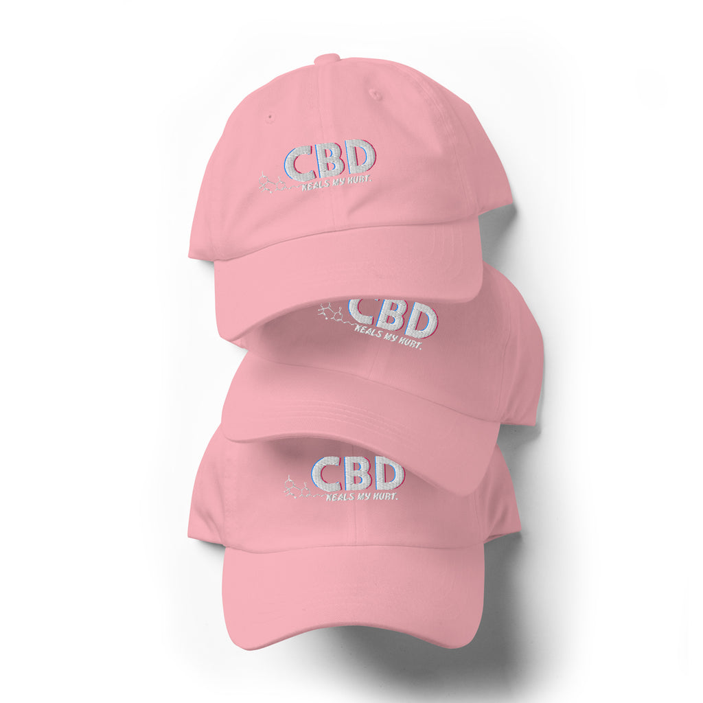Three pink CBD Heals My Hurt embroidered dad hats arranged in a vertical product display.