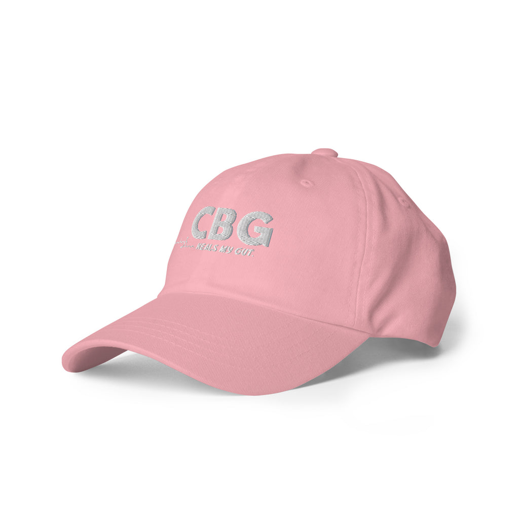 Left-front view of the soft pink CBG Heals My Gut dad hat highlighting the embroidered front design and relaxed silhouette.