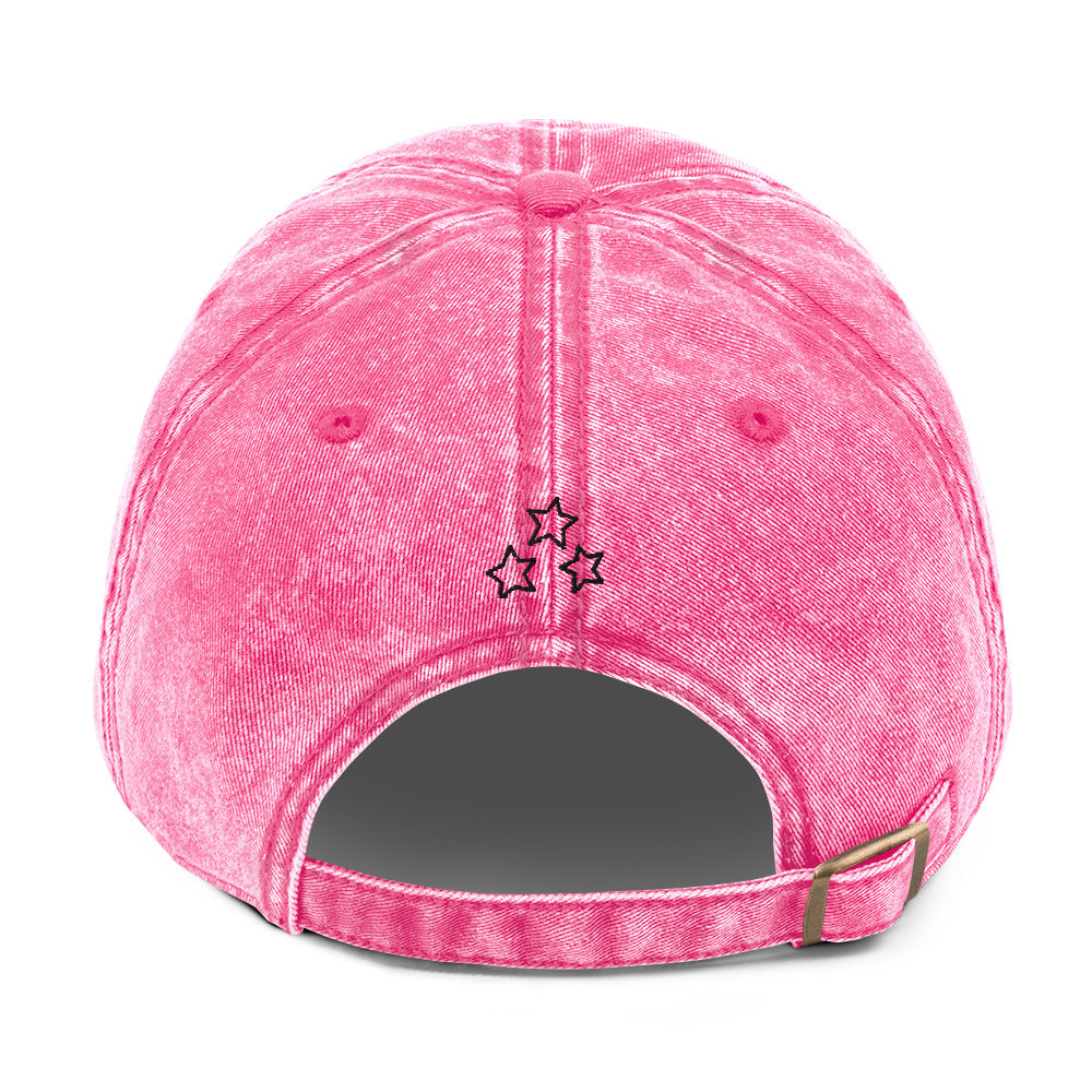 Back view of the pink vintage cotton twill cap with three outlined stars, adjustable strap and brass buckle.