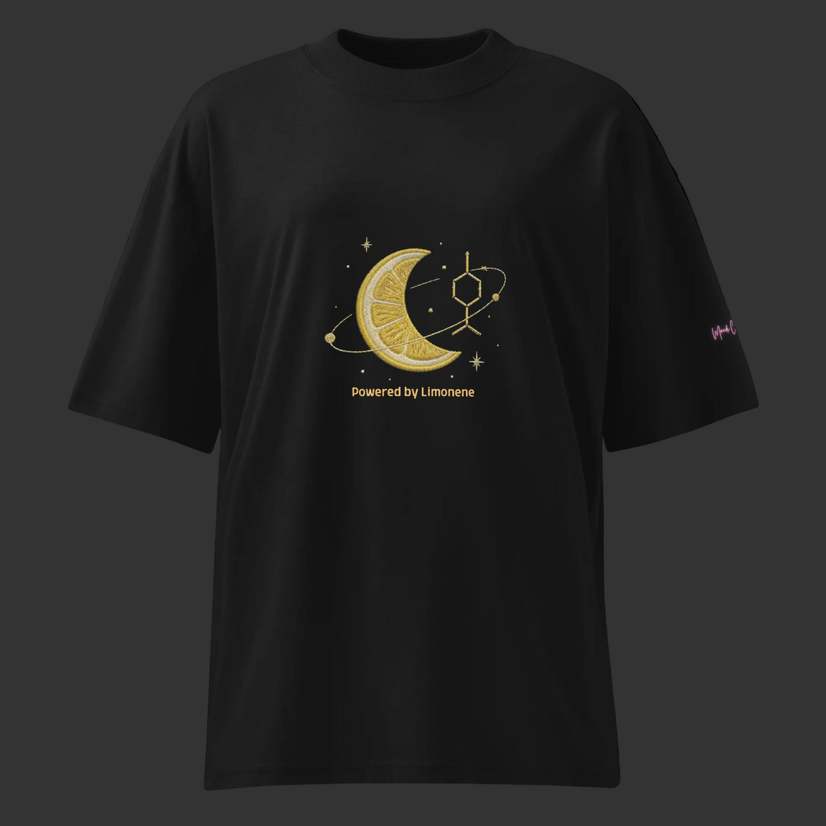 Front view of the black Powered by Limonene oversized organic tee featuring a yellow lemon-and-moon graphic with stars.