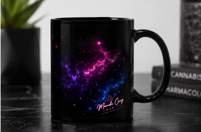 Back view of a black Science Meets Stardust coffee mug featuring purple, pink, and blue galaxy artwork on a black marble table.