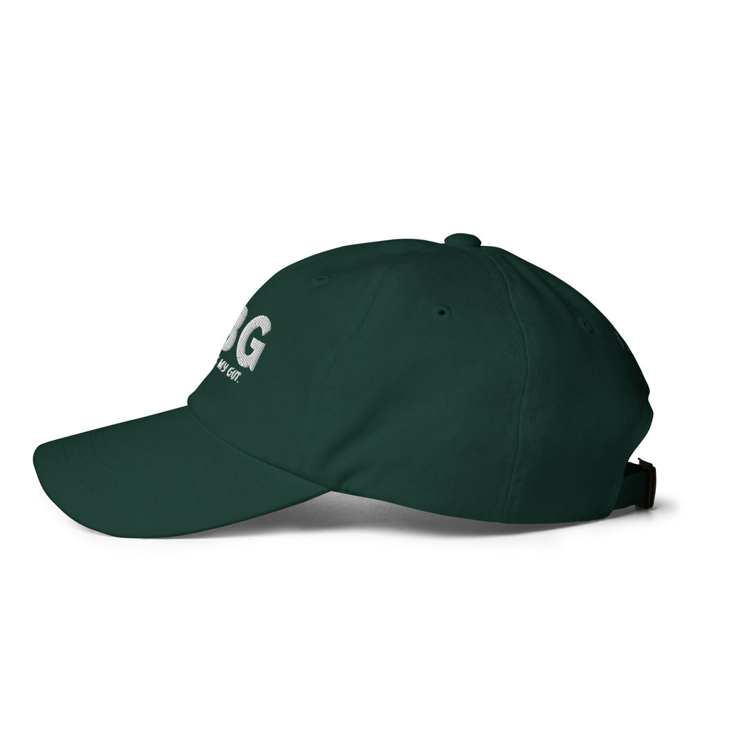Left-side view of the spruce green CBG Heals My Gut dad hat showing its curved brim, six-panel crown and embroidered eyelets.