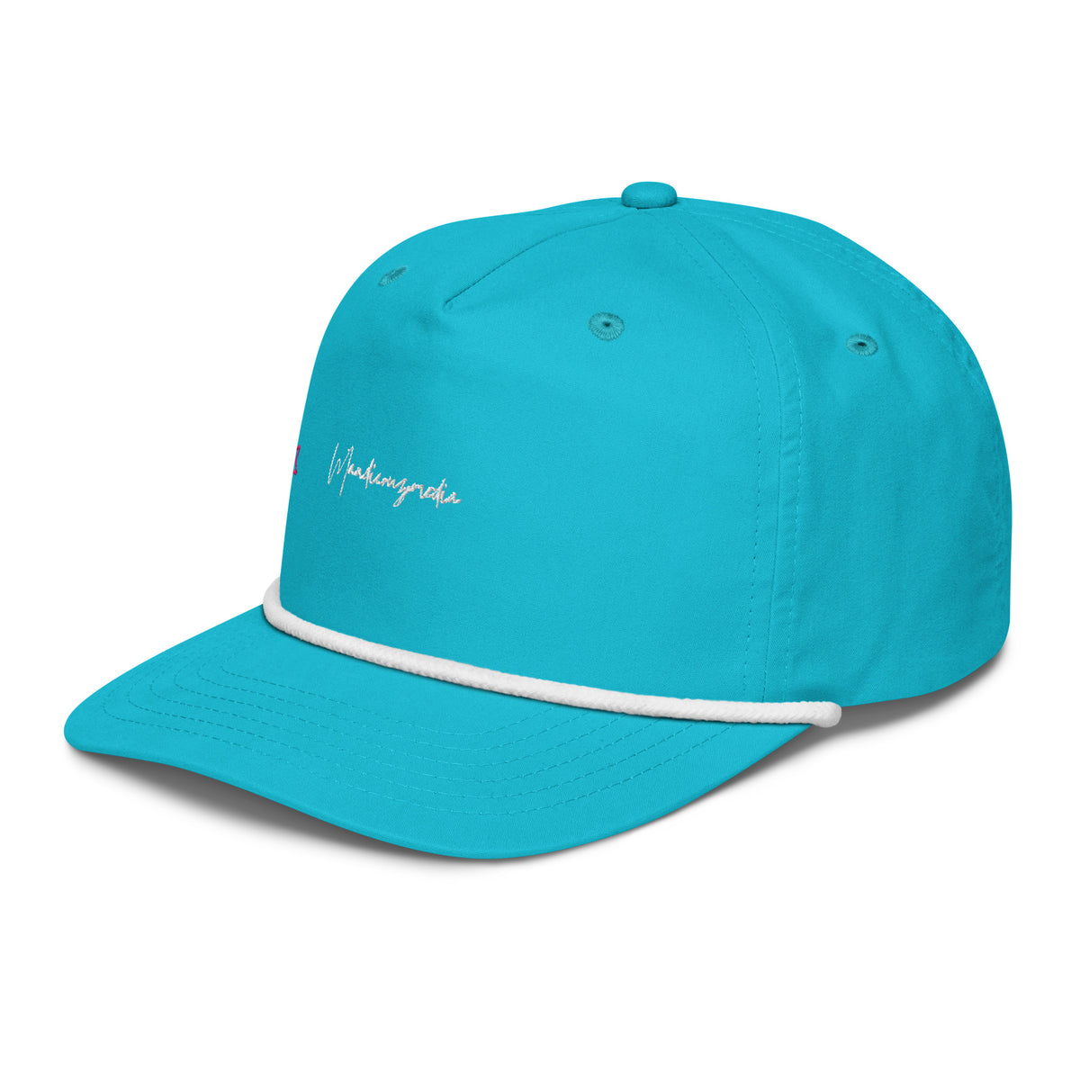 Left-front angle of the turquoise embroidered golf cap showing the white rope trim and Mandi Cruz Media script