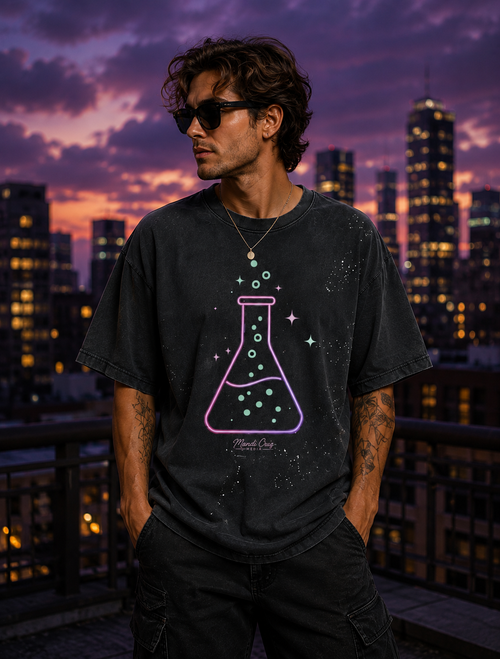 Lifestyle front view of a model wearing the black Beaker™ hand-frayed paint-splatter T-shirt by Mandi Cruz Media.
