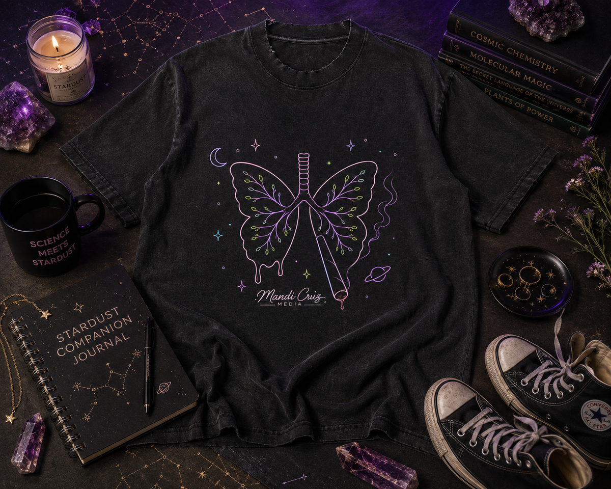 Lifestyle detail view of the Mandi Cruz Media Butterfly Lungs™ T-shirt showing its vintage-washed cotton finish, frayed details, and oversized fit.