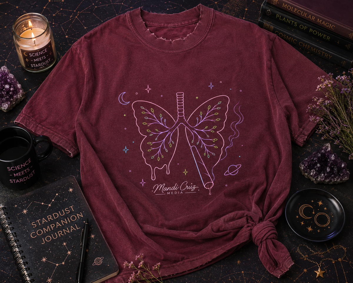 Lifestyle detail view of the Mandi Cruz Media Butterfly Lungs™ T-shirt showing its vintage-washed cotton finish, frayed details, and oversized fit.