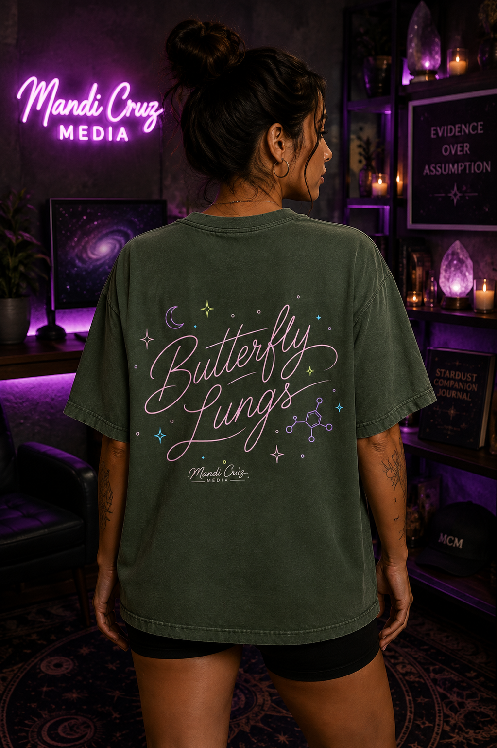 Lifestyle back view of a model wearing the Mandi Cruz Media Butterfly Lungs™ vintage washed T-shirt highlighting the signature graphic artwork.