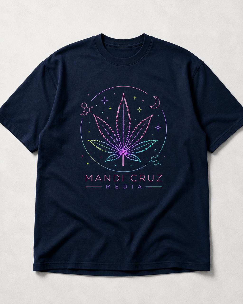 Front view of navy blue Mandi Cruz Media drop shoulder T-shirt featuring a colorful celestial cannabis leaf graphic.