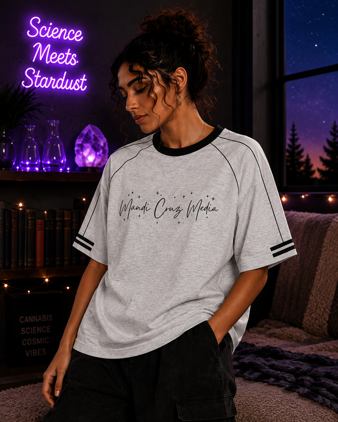 Front lifestyle view of a woman wearing the Flower Gray Mandi Cruz Media Signature™ Raglan Tee with black contrast trim.