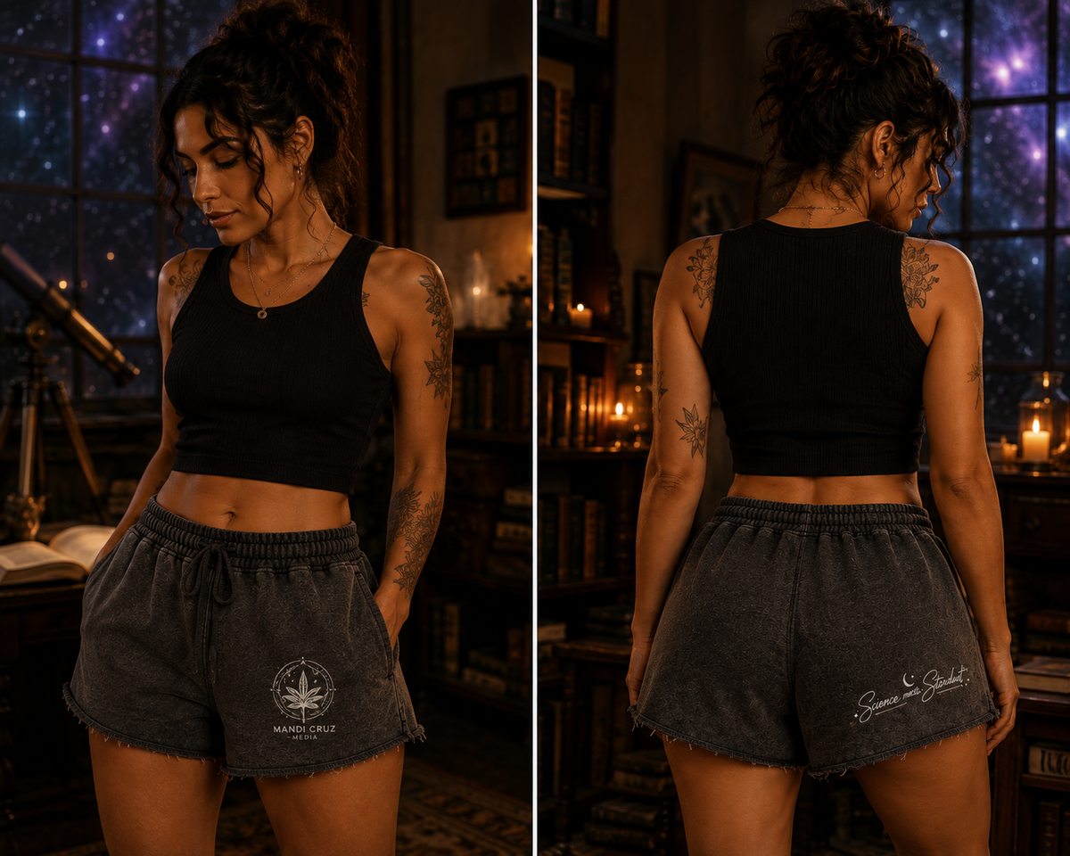 Front and back lifestyle views of Mandi Cruz Media Science Meets Stardust™ snow-washed raw-edge shorts in charcoal gray with cosmic graphics.