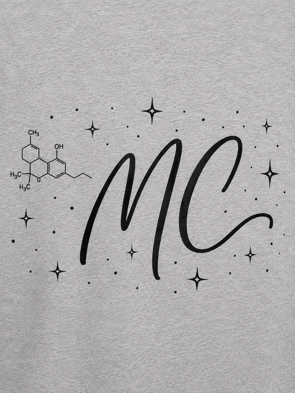Close-up back graphic detail of the light gray Mandi Cruz Media Signature™ Raglan Tee featuring the MC monogram, cannabinoid molecule, and celestial stars.