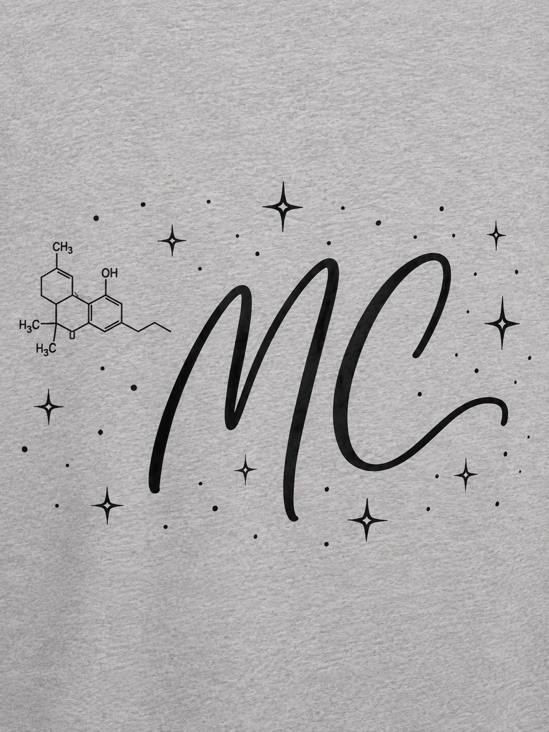 Close-up back graphic detail of the light gray Mandi Cruz Media Signature™ Raglan Tee featuring the MC monogram, cannabinoid molecule, and celestial stars.