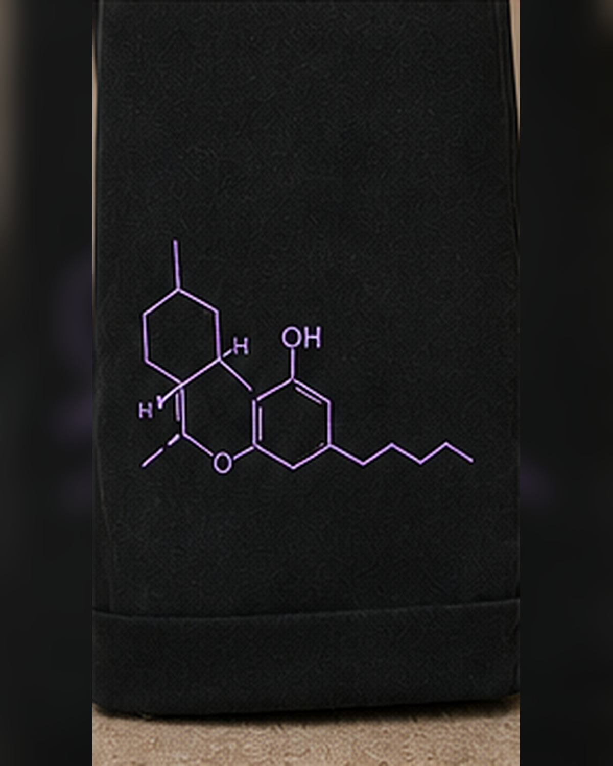 A close-up of THC Molecule TENCEL™ Wide-Leg Trousers featuring a light purple chemical structure of artemisinin.