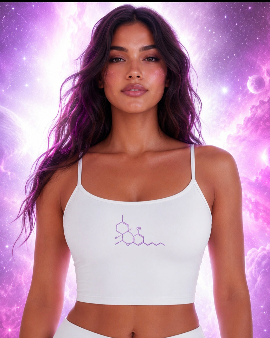 Front lifestyle view of a woman wearing the white Neon THC Molecule Crop Tank featuring a purple THC molecular structure graphic against a pink and violet galaxy background.