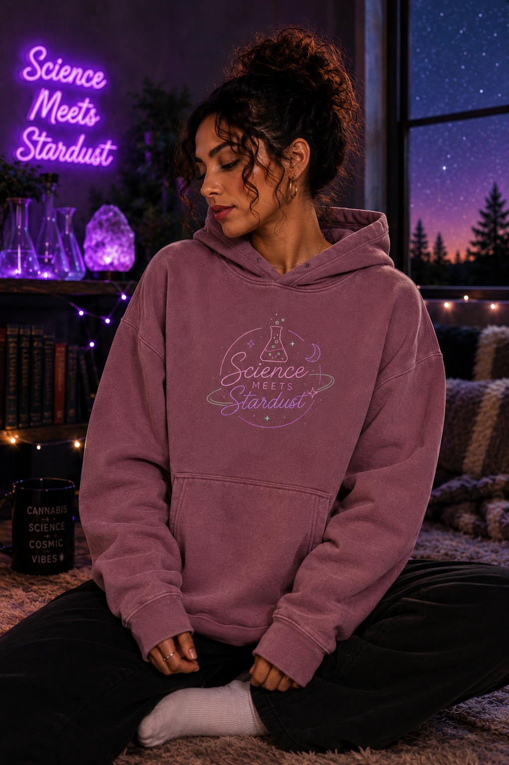 Front lifestyle view of a model wearing the Jujube Red Mandi Cruz Media Smoker’s Lips™ snow wash oversized hoodie in a cosmic Science Meets Stardust setting.